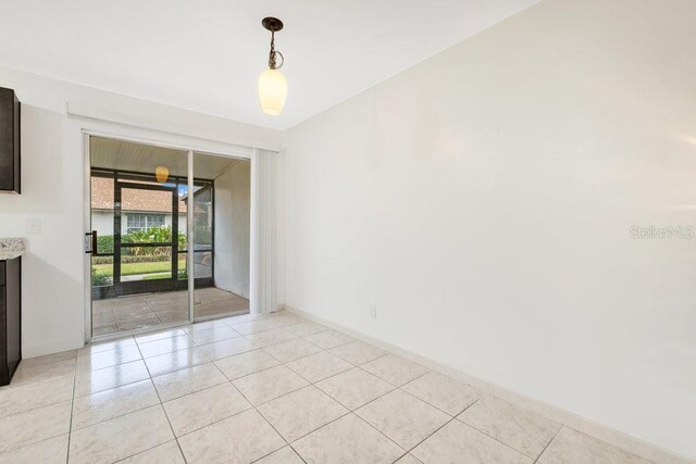 5763 Saint Christopher Dr Unit 55, Orlando, FL 32822 - empty room with baseboards and light tile patterned flooring