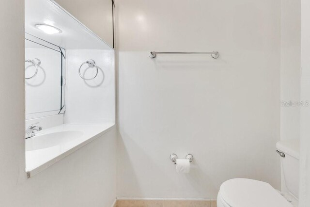 5763 Saint Christopher Dr Unit 55, Orlando, FL 32822 - half bath featuring toilet and vanity