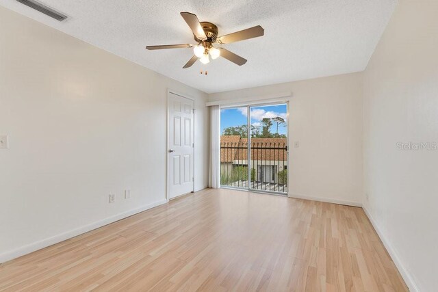 5763 Saint Christopher Dr Unit 55, Orlando, FL 32822 - unfurnished room featuring light wood finished floors, visible vents, a textured ceiling, and a ceiling fan