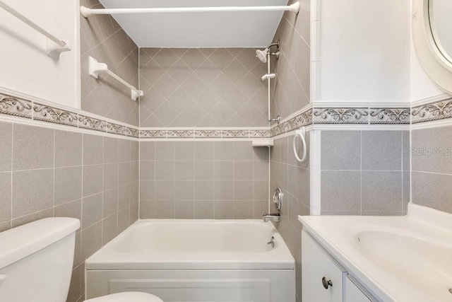 5763 Saint Christopher Dr Unit 55, Orlando, FL 32822 - full bathroom featuring tile walls, toilet, vanity, and bathing tub / shower combination