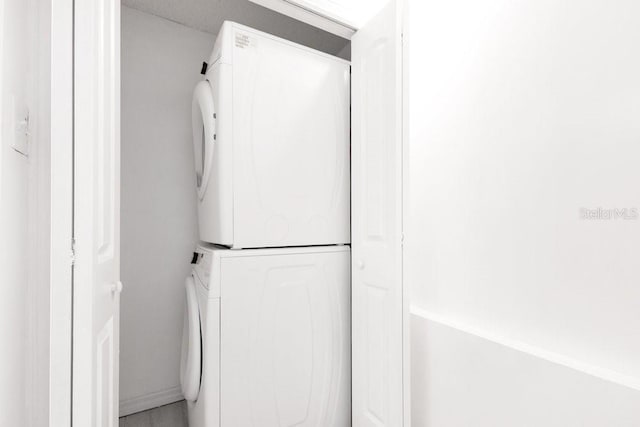 5763 Saint Christopher Dr Unit 55, Orlando, FL 32822 - laundry room with stacked washer / drying machine and laundry area