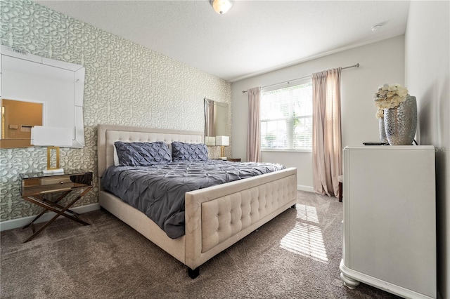 bedroom with wallpapered walls, carpet floors, and baseboards