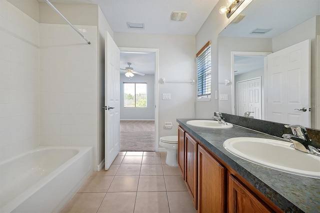 bathroom featuring a sink, tile patterned floors, toilet, and visible vents