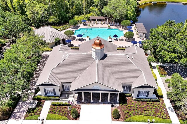 birds eye view of property with a water view