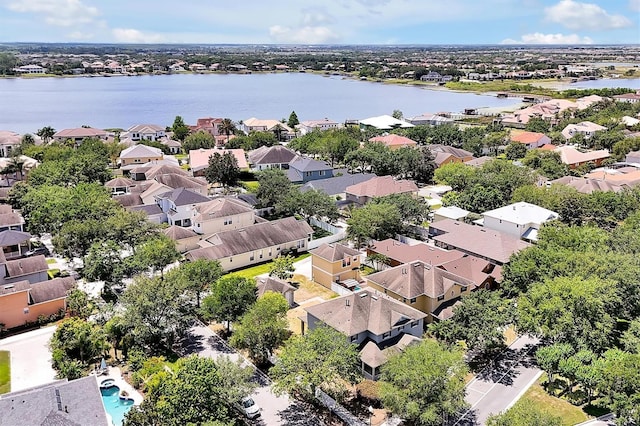drone / aerial view with a water view and a residential view