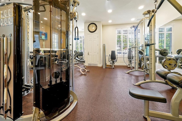 gym featuring recessed lighting and baseboards