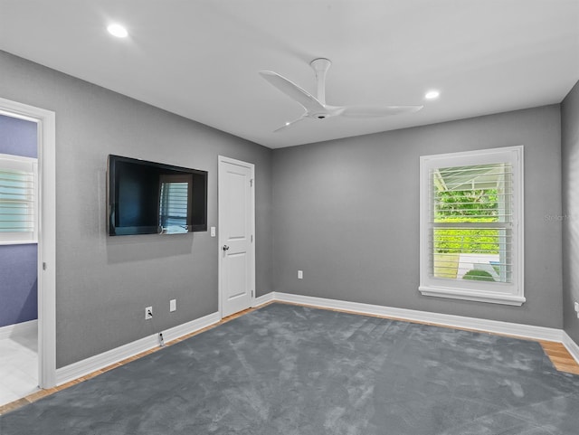 spare room featuring baseboards, ceiling fan, and recessed lighting