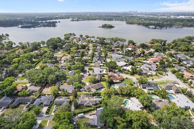 drone / aerial view with a residential view and a water view