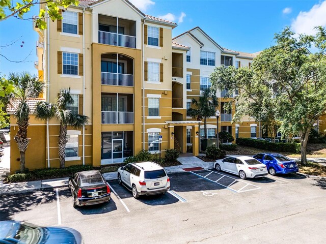 3314 Robert Trent Jones Dr Unit 308, Orlando, FL 32835 - view of property with uncovered parking