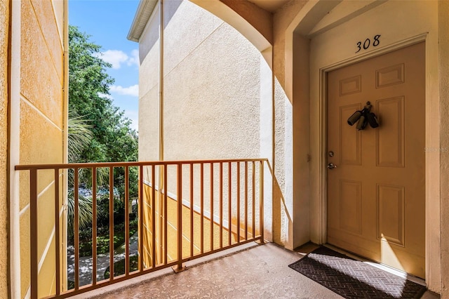 3314 Robert Trent Jones Dr Unit 308, Orlando, FL 32835 - property entrance featuring a balcony and stucco siding