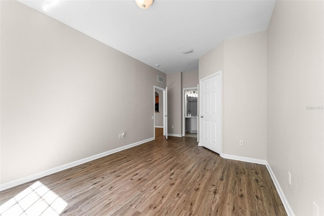 3314 Robert Trent Jones Dr Unit 308, Orlando, FL 32835 - unfurnished bedroom with visible vents, baseboards, and wood finished floors