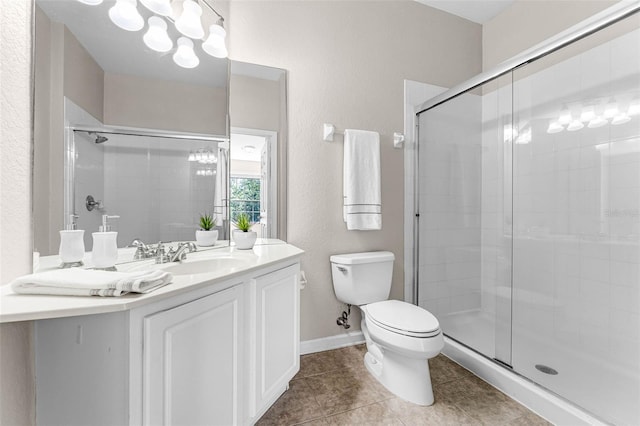 3314 Robert Trent Jones Dr Unit 308, Orlando, FL 32835 - bathroom featuring a shower stall, tile patterned flooring, and toilet