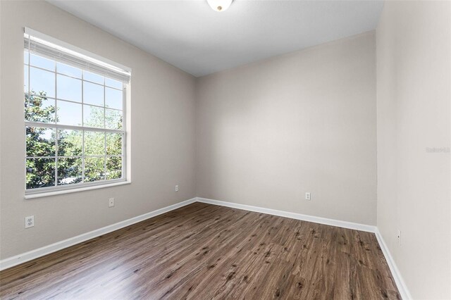 3314 Robert Trent Jones Dr Unit 308, Orlando, FL 32835 - unfurnished room with dark wood-type flooring and baseboards