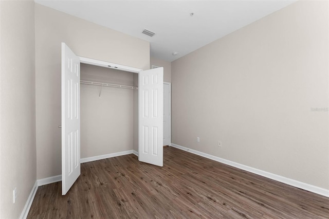 3314 Robert Trent Jones Dr Unit 308, Orlando, FL 32835 - unfurnished bedroom with a closet, visible vents, baseboards, and wood finished floors