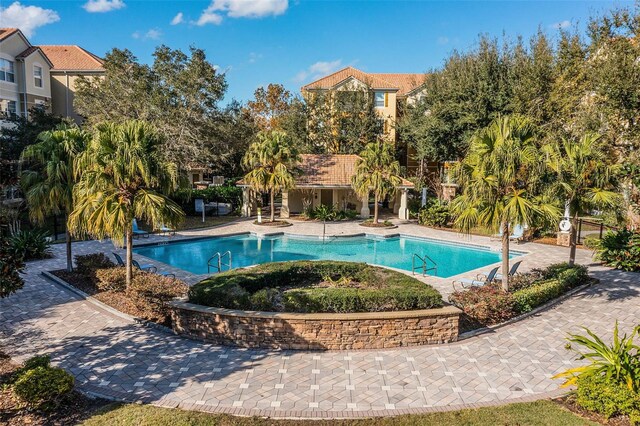 3314 Robert Trent Jones Dr Unit 308, Orlando, FL 32835 - pool with fence and a patio
