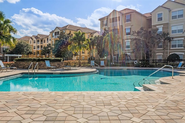 3314 Robert Trent Jones Dr Unit 308, Orlando, FL 32835 - community pool with a patio and fence