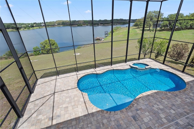 view of swimming pool with a patio, glass enclosure, a water view, and a pool with connected hot tub