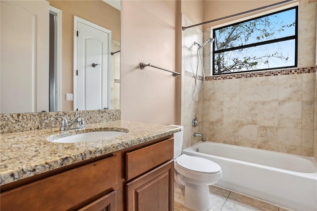 full bath with tile patterned floors, bathing tub / shower combination, toilet, and vanity