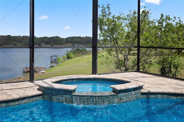 view of swimming pool with a pool with connected hot tub and a lawn