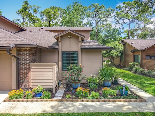 419 Newton Pl, Longwood, FL 32779 - view of front of house with a garage and roof with shingles