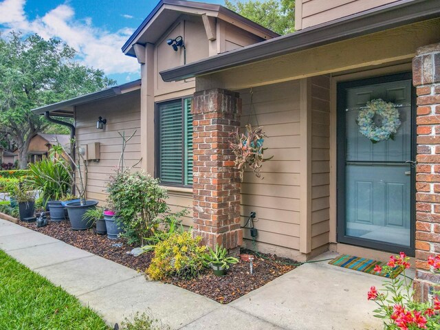 419 Newton Pl, Longwood, FL 32779 - doorway to property with brick siding