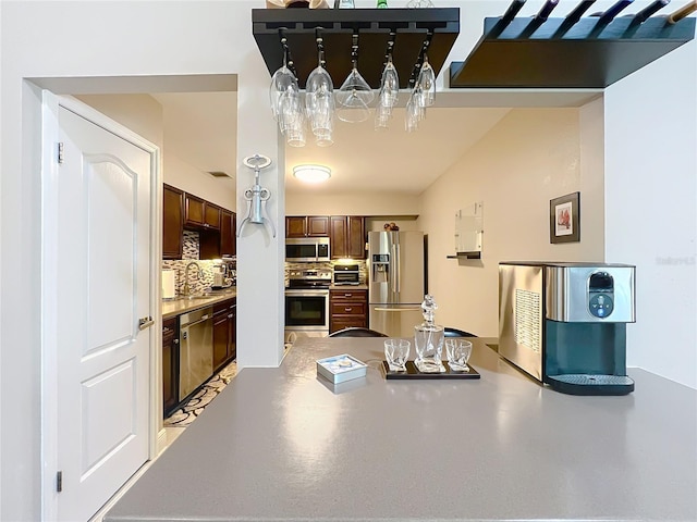 419 Newton Pl, Longwood, FL 32779 - kitchen with backsplash, a sink, appliances with stainless steel finishes, and visible vents