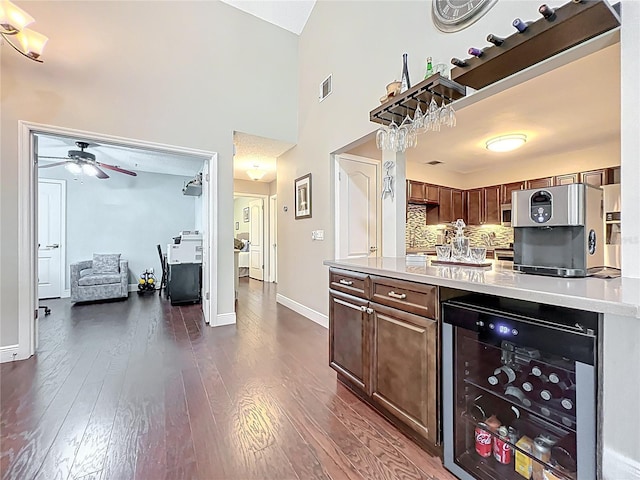 419 Newton Pl, Longwood, FL 32779 - kitchen with light countertops, visible vents, ceiling fan, beverage cooler, and dark wood-style floors