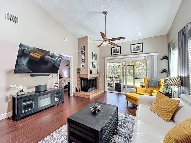 419 Newton Pl, Longwood, FL 32779 - living area featuring a textured ceiling, visible vents, ceiling fan, a fireplace, and hardwood / wood-style floors