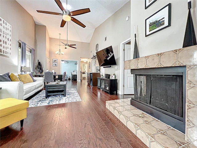 419 Newton Pl, Longwood, FL 32779 - living area featuring high vaulted ceiling, ceiling fan, wood finished floors, and a fireplace with raised hearth