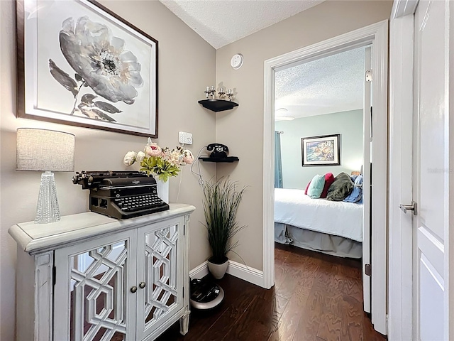 419 Newton Pl, Longwood, FL 32779 - hallway with baseboards, a textured ceiling, and dark wood finished floors