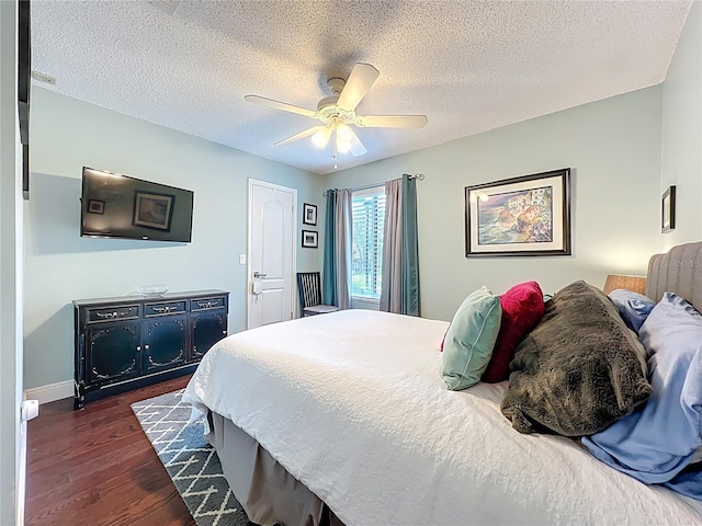 419 Newton Pl, Longwood, FL 32779 - bedroom with dark wood-type flooring, baseboards, a textured ceiling, visible vents, and a ceiling fan
