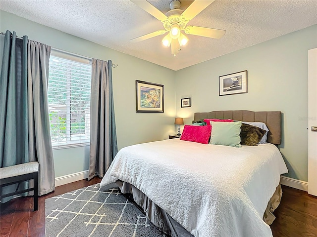 419 Newton Pl, Longwood, FL 32779 - bedroom with a textured ceiling, baseboards, ceiling fan, and wood finished floors