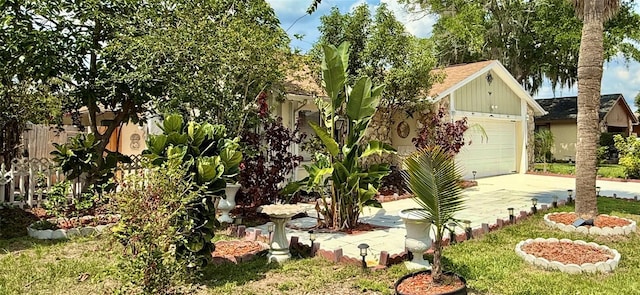329 Kantor Blvd, Casselberry, FL 32707 - view of yard featuring concrete driveway and an attached garage