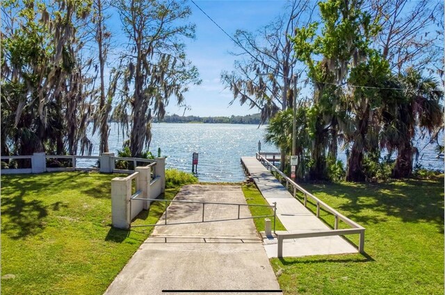 329 Kantor Blvd, Casselberry, FL 32707 - dock featuring a water view and a yard