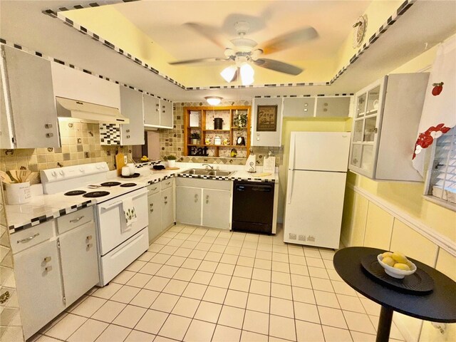 329 Kantor Blvd, Casselberry, FL 32707 - kitchen with white appliances, light countertops, under cabinet range hood, light tile patterned floors, and a ceiling fan
