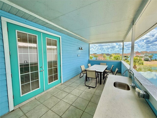 7968 Shaker St, Kissimmee, FL 34747 - view of patio / terrace featuring outdoor dining space, a residential view, a water view, and a sink