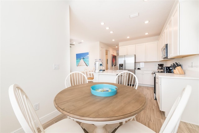7968 Shaker St, Kissimmee, FL 34747 - dining area featuring recessed lighting, light wood-style floors, and baseboards