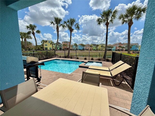7968 Shaker St, Kissimmee, FL 34747 - view of pool featuring a fenced in pool, a residential view, a patio, area for grilling, and fence