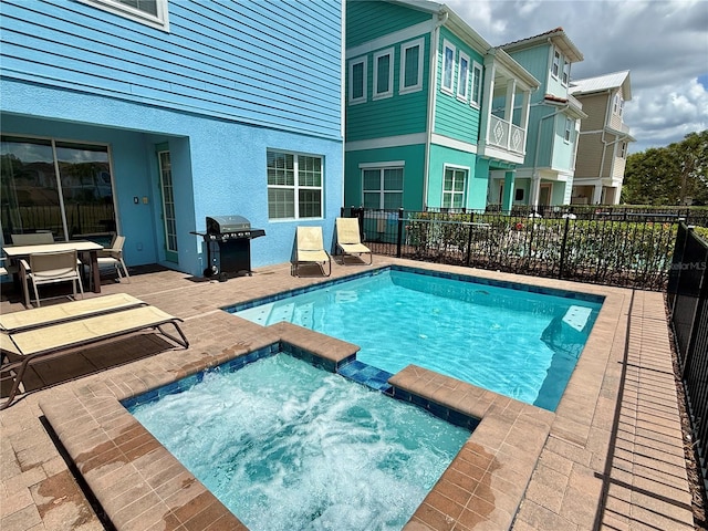 7968 Shaker St, Kissimmee, FL 34747 - view of swimming pool featuring a grill, a patio, fence, an in ground hot tub, and a fenced in pool