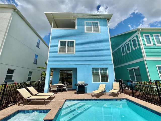 7968 Shaker St, Kissimmee, FL 34747 - back of house featuring a patio area, a fenced in pool, and fence