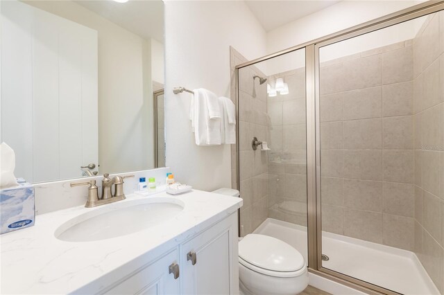 7968 Shaker St, Kissimmee, FL 34747 - bathroom with toilet, vanity, and a stall shower