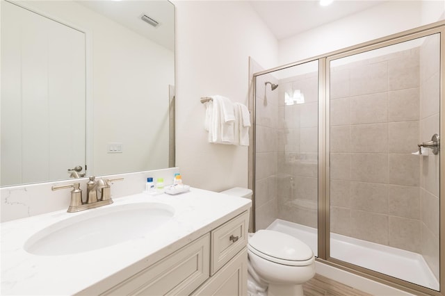 7968 Shaker St, Kissimmee, FL 34747 - bathroom with a shower stall, vanity, visible vents, and toilet