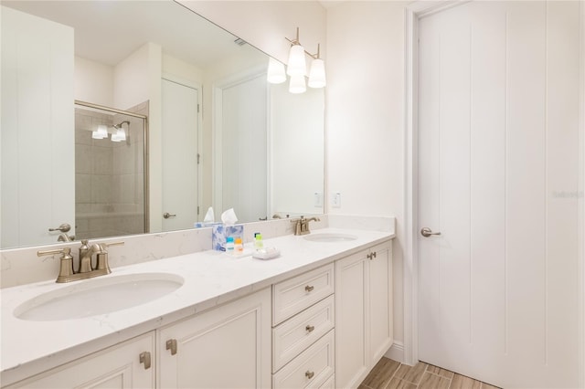 7968 Shaker St, Kissimmee, FL 34747 - bathroom featuring a sink, double vanity, and a stall shower