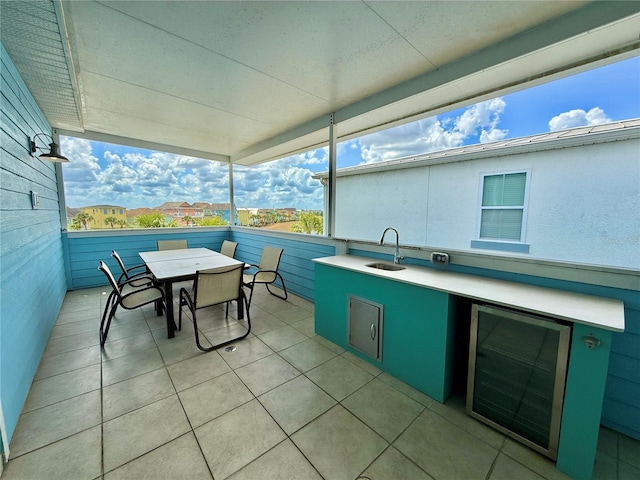 7968 Shaker St, Kissimmee, FL 34747 - view of patio / terrace featuring area for grilling, outdoor dining area, a sink, and beverage cooler