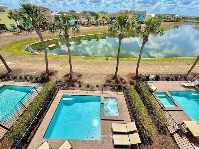 7968 Shaker St, Kissimmee, FL 34747 - community pool with a residential view, a patio area, fence, and a water view