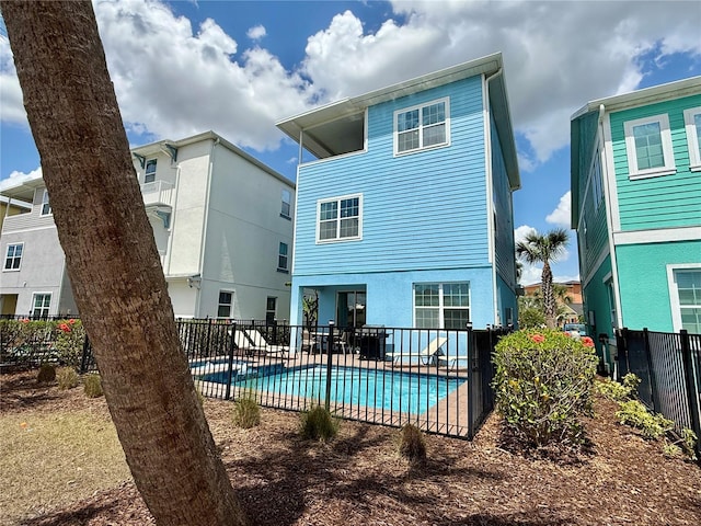 7968 Shaker St, Kissimmee, FL 34747 - rear view of house featuring a patio, a fenced in pool, and fence