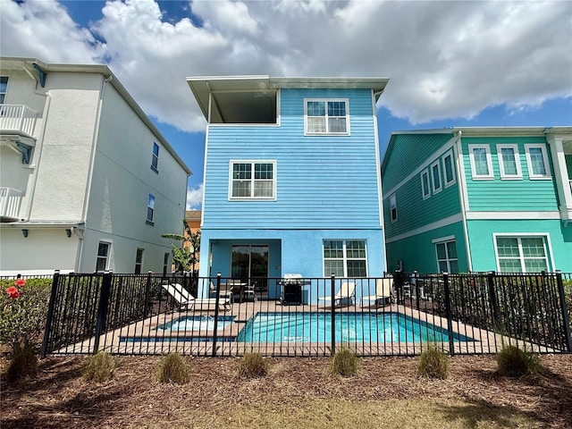 7968 Shaker St, Kissimmee, FL 34747 - back of property featuring a fenced in pool, a patio area, and fence