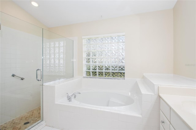 bathroom featuring a stall shower, recessed lighting, vanity, and a garden tub