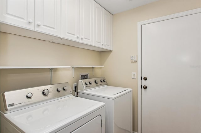 laundry area with cabinet space and washer and dryer