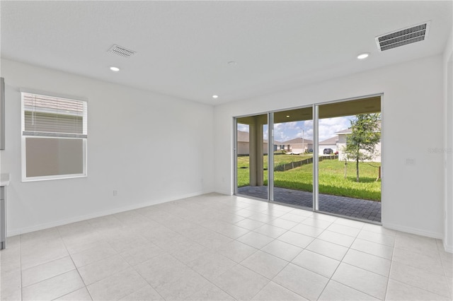 503 Silver Palm Dr, Haines City, FL 33844 - empty room with light tile patterned floors and recessed lighting
